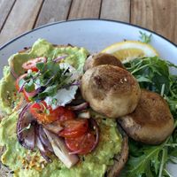 Smashed avo on sourdough with a side of mushrooms is what I ordered, but then she bought me “gourmet toast” which I was very pleased about - yummo!  at Gratitude in Tauranga