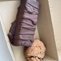 Take away snickers and PB protein cookie!🍪   at Gratitude in Tauranga