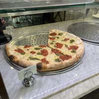 Basil cashew pesto, vegan mozzarella, and crushed plum tomato  at Uncle Tony's Pizza in New York City