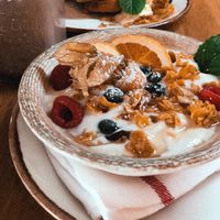 soy yogurt with fruit, homemade granola and agave syrup  at Kunsthauscafé in Graz