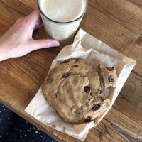 Iced oat milk latte, salted vegan chocolate chip cookie. at Honest Greens - Plaça Catalunya in Barcelona