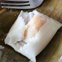 little dessert - the white "pudding" might be something like... glutinous rice flour?? the middle is a banana. at Berkah Vegan in Dalung