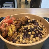 Attieke as a base, mafe peanut sauce, sauté vegan, plantains and some tomato sauce  at Osè African Cuisine in Paris