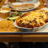 Vegetarian Moussaka (V)

Layers of sliced Mediterranean vegetables topped with béchamel sauce, tomato sauce and finished with a sprinkle

of mozzarella served with  at The Olive Branch in Ilkley