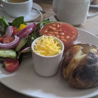 Jacket potato with vegan cheese at The Secret Garden in Dorchester