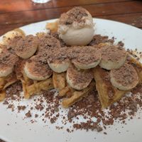 Photo doesn't do it justice... waffle hidden by all the toppings! at The Secret Garden in Dorchester