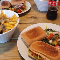 Poutine side dish and tomato, pesto and mozzarella panini at The Secret Garden in Dorchester
