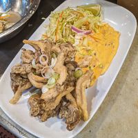 Deep fried oyster mushrooms w/ coleslaw & garlic aioli remoulade. at Millennium in Oakland