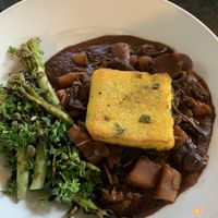 Polenta with porcini red wine sauce   at Millennium in Oakland