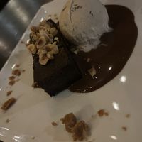 Mochi Brownie w/ Hazelnut Oat Crumble, Frangelico Tcho milk chocolate sauce, coconut cacao nib ice cream, cashew butter toffee  at Millennium in Oakland
