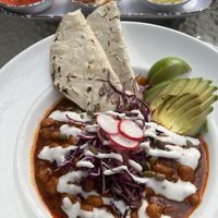 Red Chile Pozole. Would have taken more pics but we kept eating everything the second it hit the table! You can see the remnants of a salsa flight in the background though    at Bang Bang Kitchen in Seattle