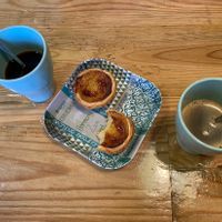Coffee and vegan pastel de nata   at Izzy's Market Vegetarian Boutique in Vila Do Bispo