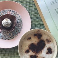 Energy ball and cappuccino  at Izzy's Market Vegetarian Boutique in Vila Do Bispo