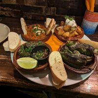 Spinach and chickpea curry, potatas bravas, padron peppers and vine leaves at The Square Orange in Keswick