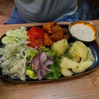 Tempeh with potatoes and salads  at no bones in Krakow