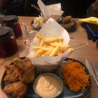 fried oysters and fish in the background   at no bones in Krakow