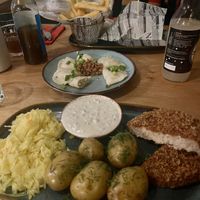 Boneless fish, pierogies and burger. SO GOOD 🤤  at no bones in Krakow