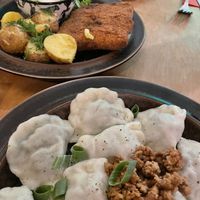 Pierogi and ‘pork’ chop with dill potatoes and cucumber sour cream salad ❤️  at no bones in Krakow