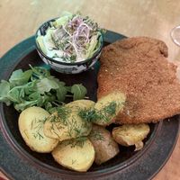 Polish chop with traditional cucumber salad   at no bones in Krakow