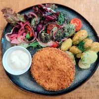 NO CHICKEN
PANKO-CRUSTED PLANT-BASED "CHICKEN" CUTLET, POTATOES, SUMMER SALAD (MIXED GREENS, CHERRY TOMATOES, CUCUMBER, RED ONION, BLACK SESAME DRESSING), TARTARE at no bones in Krakow