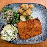 CLASSIC POLISH "PORK CHOP"
BREADED SOY CUTLET, POTATOES, CUCUMBER WITH CREAM, SPROUTS at no bones in Krakow