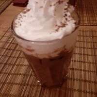 Iced latte with whipped cream at no bones in Krakow