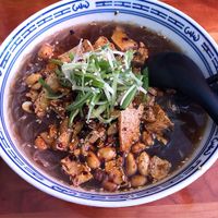 Bao's Tan Tan Men Ramen (made vegan). Vermicelli noodles in a mushroom broth topped with crispy tofu, garlic, shallots, fried soy beans, Chinese Laoganma and roasted peanuts.  at Bao in Victoria