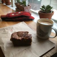 Vegan cake and an oat milk latte. The perfect antidote to a chilly Winnipeg morning! at Eadha Bakery Worker Co-op in Winnipeg