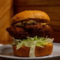 The Mama Shak - Southern Fried Seitan, Lettuce, mayo hot sauce in a potato bun. at This Borderland in Preston