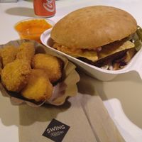 Nachos burger with nuggets beside at Swing Kitchen - Schwedenplatz in Vienna