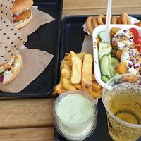 Schnitzel burger, cheese burger, nugget salad, chips, onion rings - yum!!  at Swing Kitchen - Schwedenplatz in Vienna