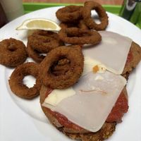 Milanesa napolitana con aros cebolla   at Guacamole in Montevideo