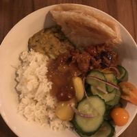 Vegan Curry bowl with lentil daal, aubergine curry, mango chutney, rice, salad and paratha  at Box Sociaal in Amsterdam