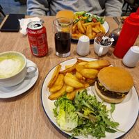 2 Bistro burgers, one with vegan cheese and one with dairy cheese, and a soya matcha latte and a cola. at Dragonfly Bistro in Aberystwyth