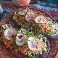 Huraches - filling in between bread and veggies at La Vegana Garnacha in Guadalajara
