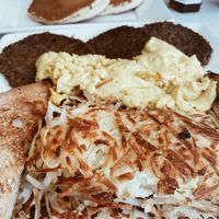 “Big Vegan Breakfast” plate with 3 vegan pancakes, 3 faux sausages, vegan eggs, hash browns, & toast #Veganuary at Anna's House in Ann Arbor