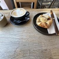 Flat white and vanilla crown  at Chapter One Coffee Shop in Edinburgh