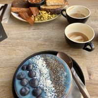 Blue smoothie bowl and a full breakfast   at Chapter One Coffee Shop in Edinburgh