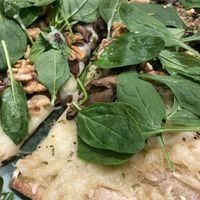 Pizza with AMAZING vegan mozzarella, oregan, spinach, nuts and mushrooms at Odacova in Barcelona