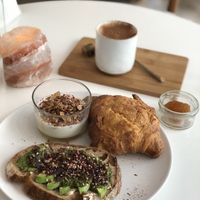 Breakfast platter + jam (avocado toast, croissant, Granola)  at Plenty in The Hague