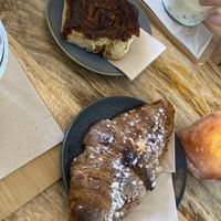 Almond croissant and cinnamon roll  at Plenty in The Hague