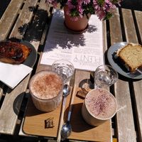 From left: cinnamon roll, chai latte, choco latte, and lemon coconut cake at Plenty in The Hague
