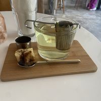 Herbal tea verbena (huge glass and good) and a small piece of cinnamon roll (great)   at Plenty in The Hague