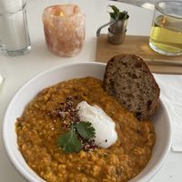 Dahl stew: tasty. The piece of bread is small for such a big bowl of dahl, but there is also rice in the stew. at Plenty in The Hague