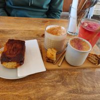 Cinnamon roll, chai latte, ceremonial cacao, rose lemonade at Plenty in The Hague