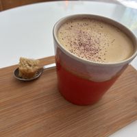 Golden choco latte: it’s quite bitter. The piece of cardamon cake was quite good. at Plenty in The Hague