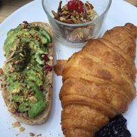Breakfast platter: croissant, granola, avo toast, choice of jam/butter/ or both!  at Plenty in The Hague