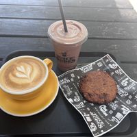 Oat milk cappuccino, vegan cookie, power Mike   at Juice Dudes in Barcelona