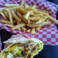 Breakfast burrito (tofu scramble, sausage, peppers, mushrooms, cheese) and add on fries at Mark of the Beastro in Salt Lake City