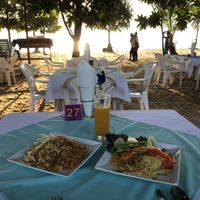 Pad Thai and Papaya Salad on their beach seating. at Phen's Restaurant in Phuket